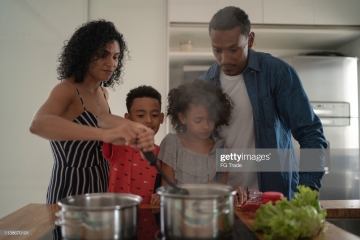 Family Cooking Together at Kitchen