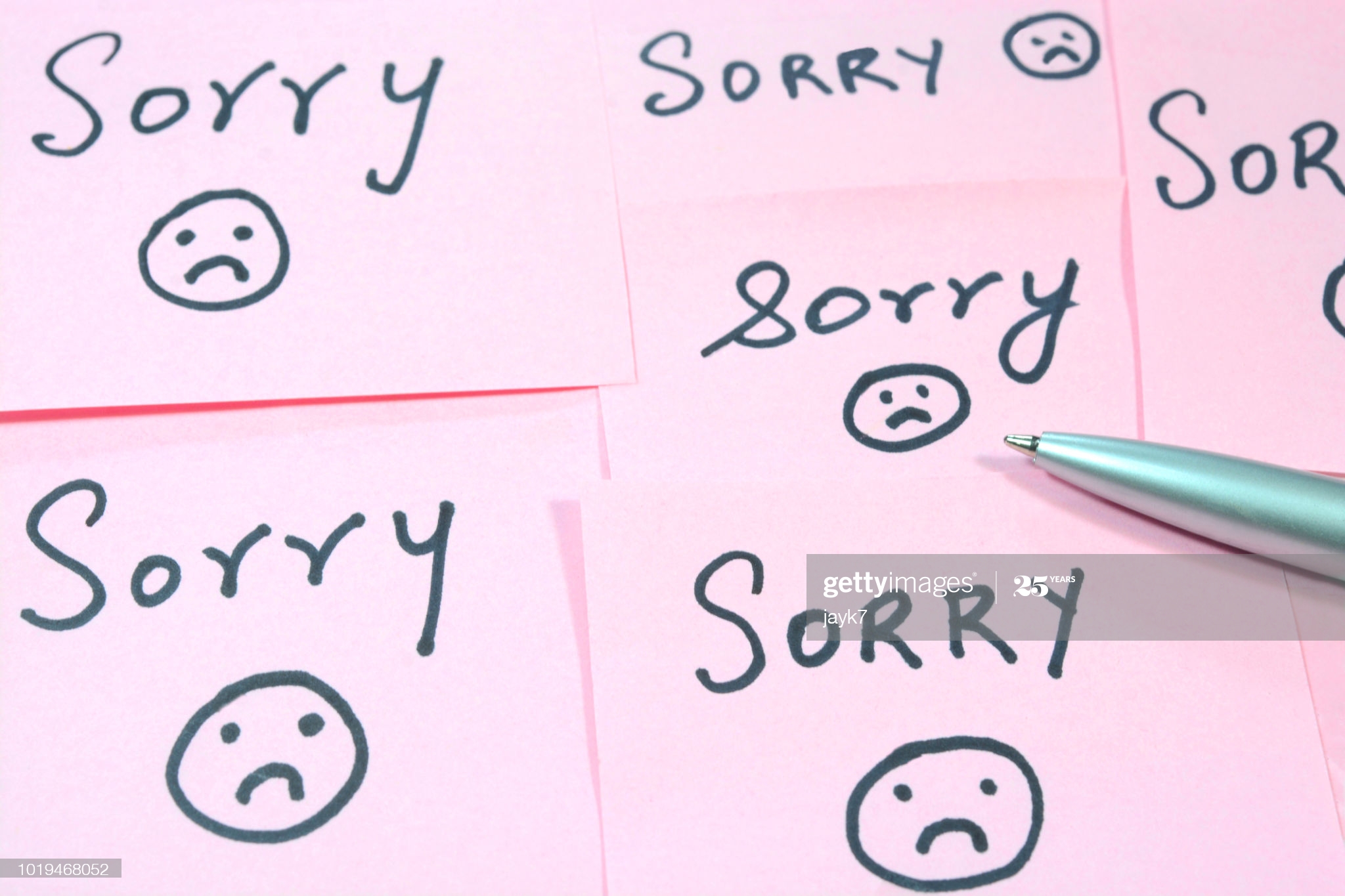 Sorry word written on adhesive sticky notes.